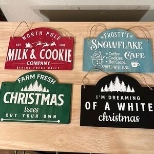 Set a four 8 x 5 and three-quarter inch Holiday signs